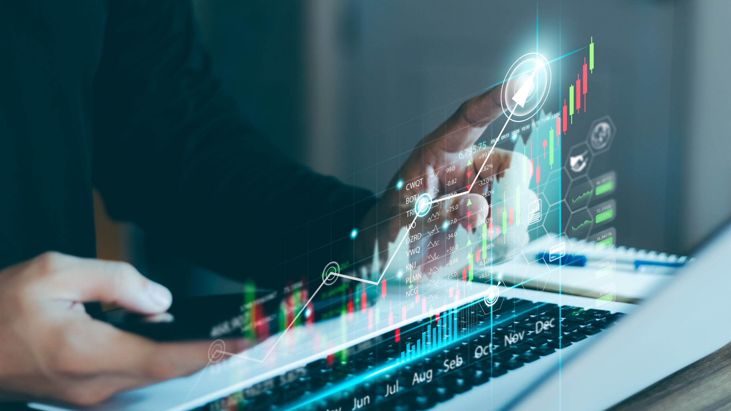 Businessman Use a laptop to analyze sales data and graph economi